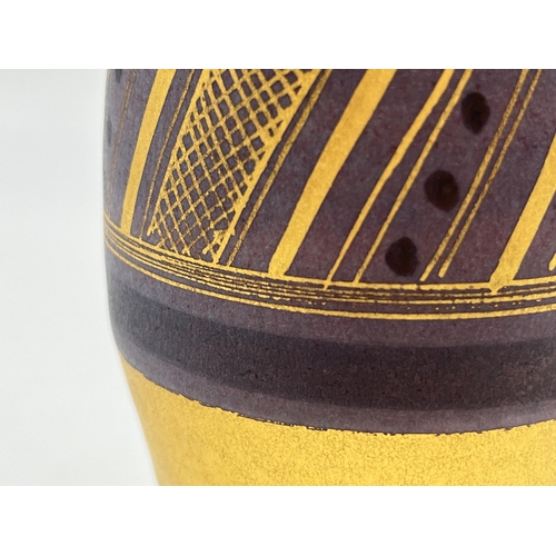 378 - A Mary Rich studio pottery solifleur vase on damson ground with gilt geometric pattern - approx. 17.... 