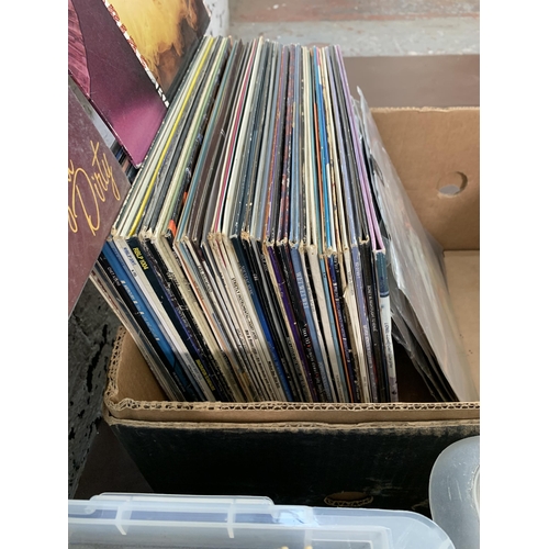 759 - Three boxes containing a collection of vinyl records to include Dire Straits, Bob Dylan, Japan, The ... 