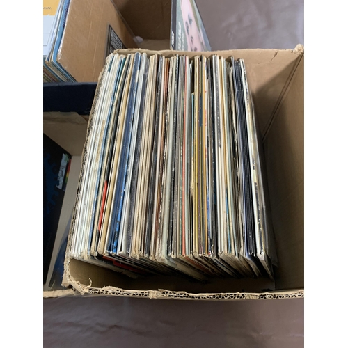 761 - Three boxes containing a collection of vinyl records to include David Bowie, The Boomtown Rats, Maha... 