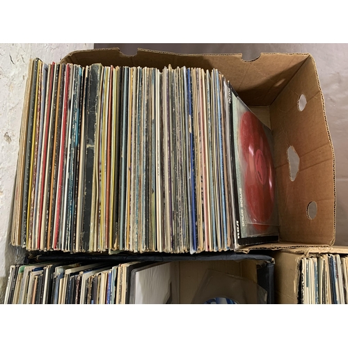 761 - Three boxes containing a collection of vinyl records to include David Bowie, The Boomtown Rats, Maha... 