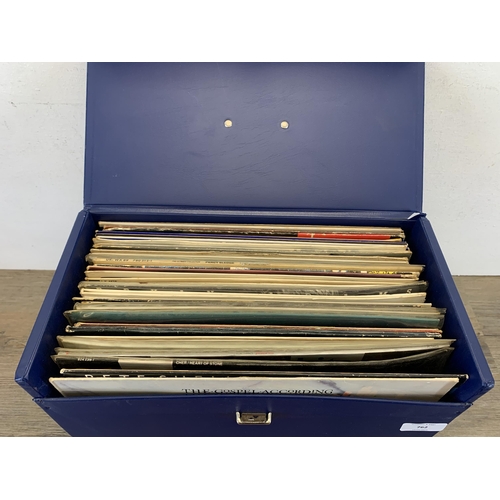 762 - A record case containing records to include Pete Shelley, The Stranglers, Big audio Dynamite, Queen,... 