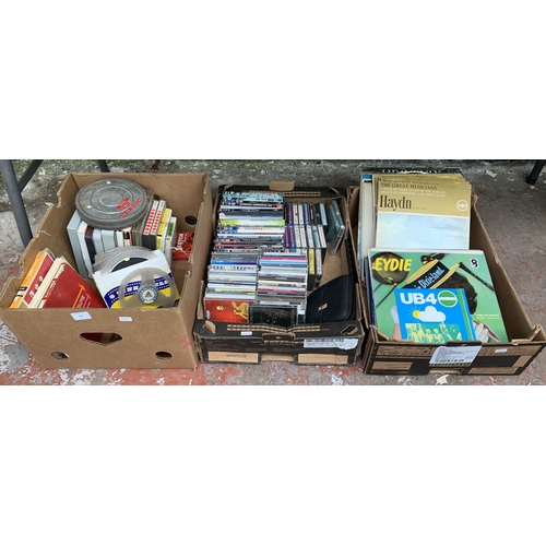 770 - Three boxes containing mixed media to include reel-to-reel tapes, 8mm cine reels, CDs, cassettes, DV... 