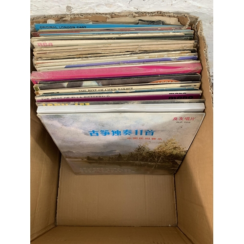 777 - Two boxes containing vinyl records to include Louis Bellson, Eric Delaney, John Lee Hooker, Ella Fit... 