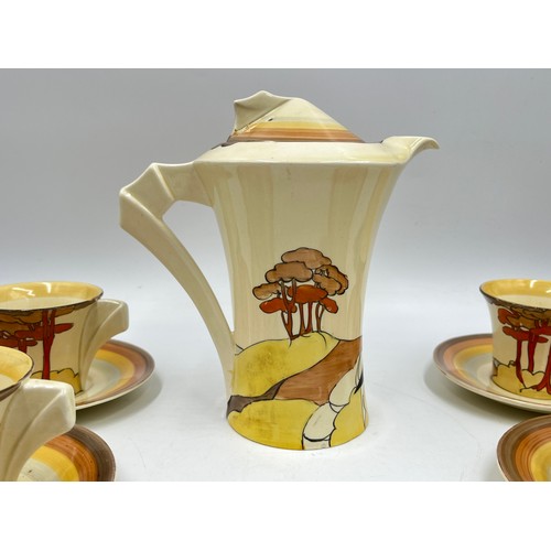 382 - A Clarice Cliff Coral Firs pattern fifteen piece coffee set comprising six cups, six saucers, coffee... 