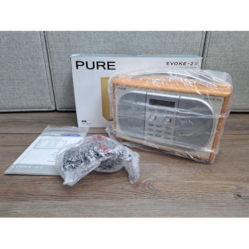 748 - A boxed Pure Evoke-2S DAB/FM radio with instruction manual