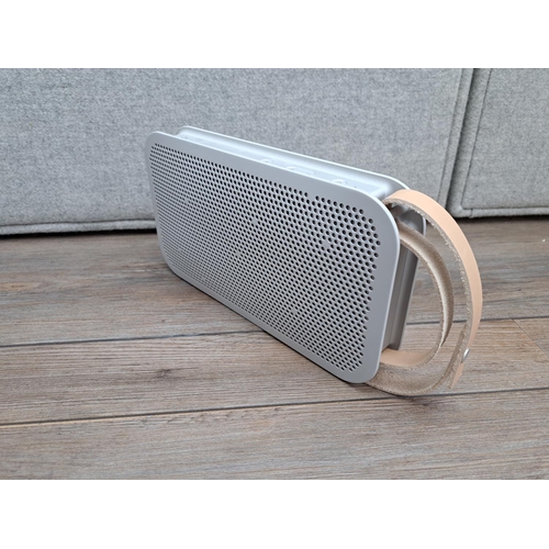 756 - A boxed Bang & Olufsen A2 Bluetooth speaker with power adapter and instruction manual