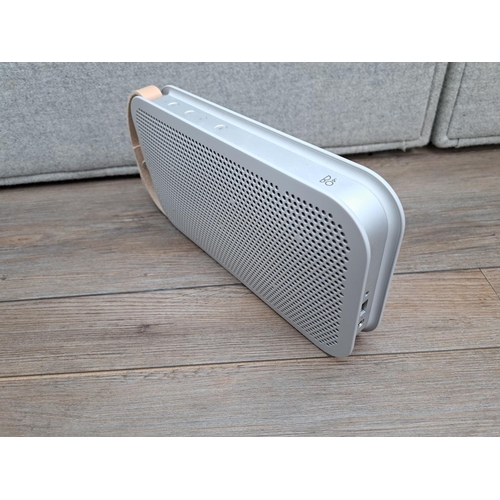 756 - A boxed Bang & Olufsen A2 Bluetooth speaker with power adapter and instruction manual