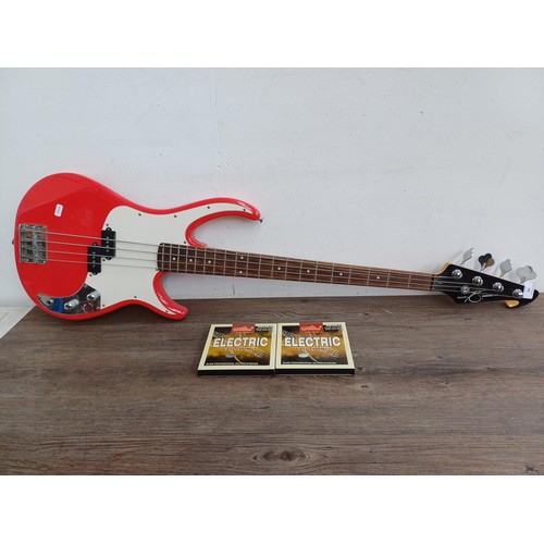 786 - A Peavey Zodiac EX electric bass guitar with two sets of Alice .095-.040 strings