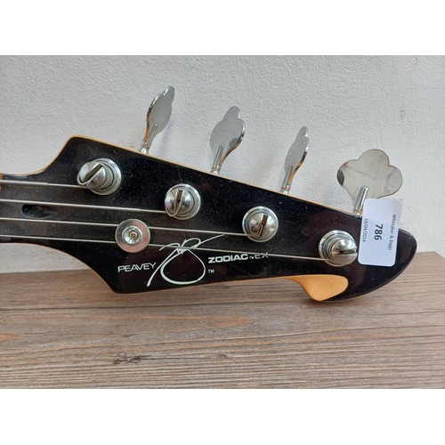 786 - A Peavey Zodiac EX electric bass guitar with two sets of Alice .095-.040 strings