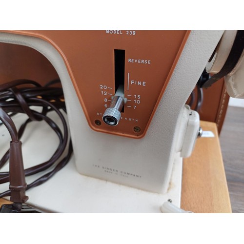 858A - A cased Singer 239 electric sewing machine with foot pedal