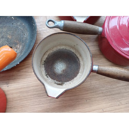 862 - Six items of French enamelled cast iron cookware, three Cousances lidded saucepans, one Le Creuset f... 