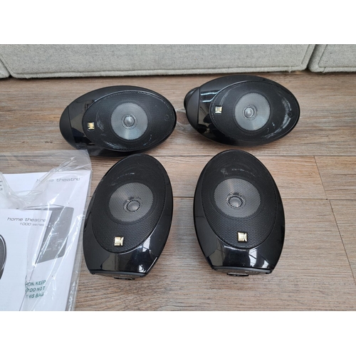 801 - Four KEF surround sound speakers with instruction manual