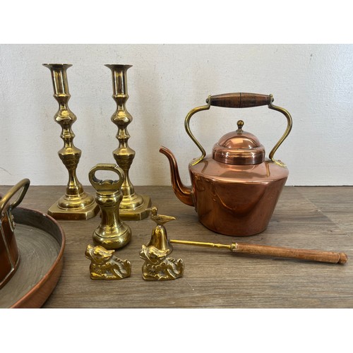 463 - Nine pieces of 19th century and later copper and brassware to include a pair of brass candlesticks -... 