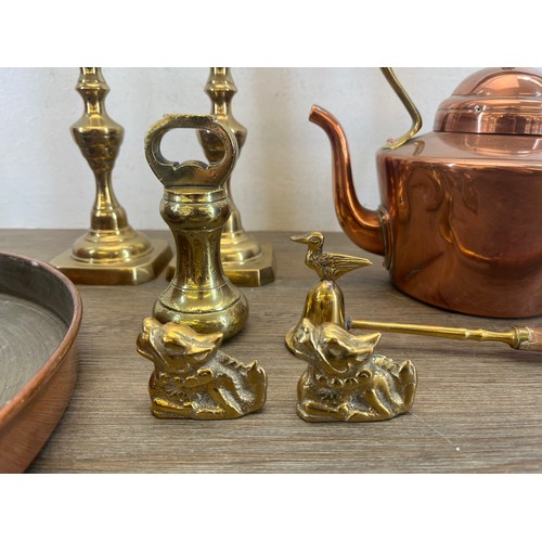 463 - Nine pieces of 19th century and later copper and brassware to include a pair of brass candlesticks -... 