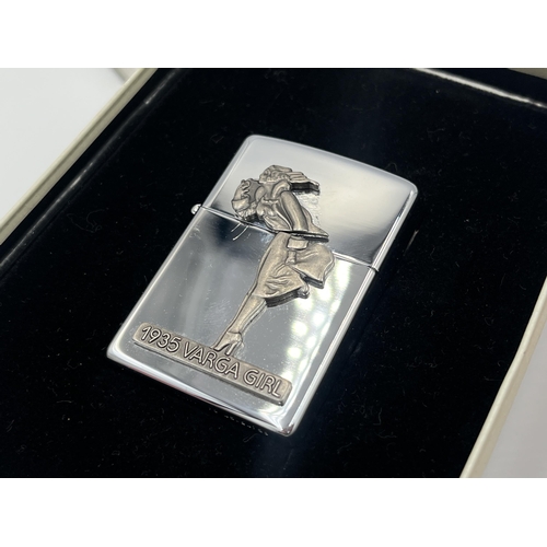 2023A - Two boxed Zippo windproof Commemorative cigarette lighters, one The Varga Girl and one 65th Annivers... 