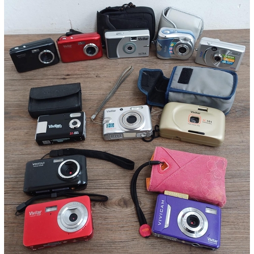 607 - Eleven Vivitar compact cameras to include two ViviCam E128 digital, ViviCam F131 digital, ViviCam F1... 