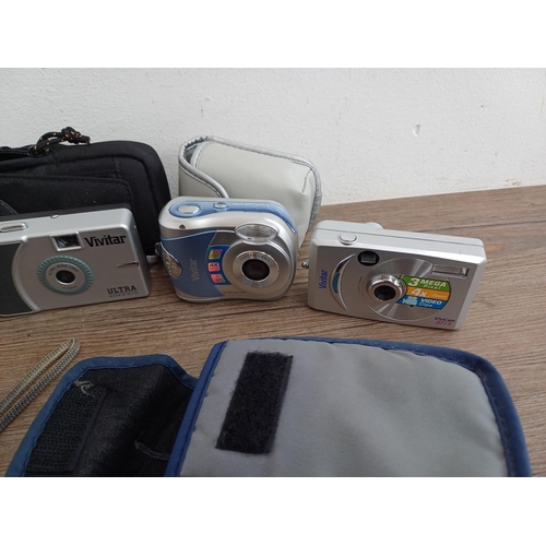 607 - Eleven Vivitar compact cameras to include two ViviCam E128 digital, ViviCam F131 digital, ViviCam F1... 