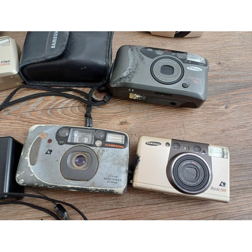 608 - Twelve compact cameras, one Rollei, six Samsung, three Hanimex, one Chinon and one Miranda