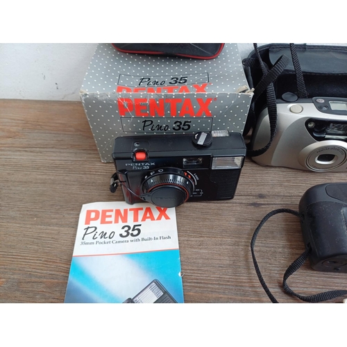 610 - Ten Pentax compact 35mm cameras to include Espio 105G, boxed and cased Pino 35, two Espio 928, Zoom ... 