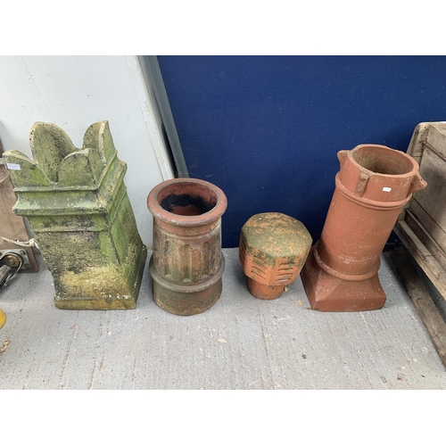 1024A - Four garden items, one cast stone chimney pot, two terracotta chimney pots and one terracotta cowl f... 