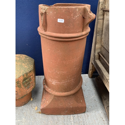 1024A - Four garden items, one cast stone chimney pot, two terracotta chimney pots and one terracotta cowl f... 