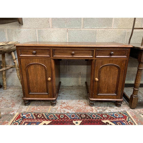 11 - A Victorian mahogany pedestal desk - approx. 76cm high x 125cm wide x 52cm deep