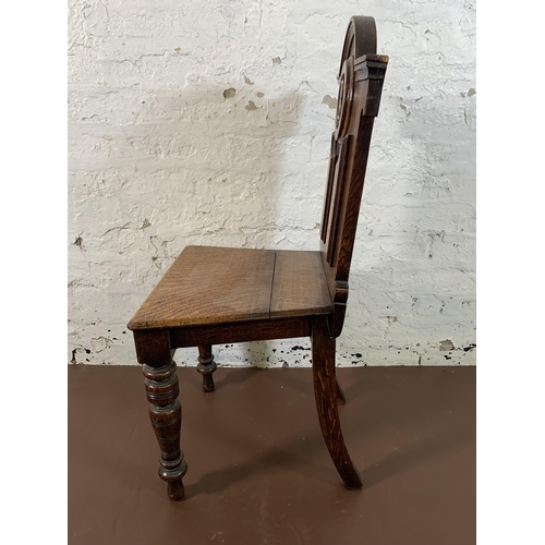 19 - A 19th century carved oak hall chair - approx. 89cm high x 43cm wide x 37cm deep