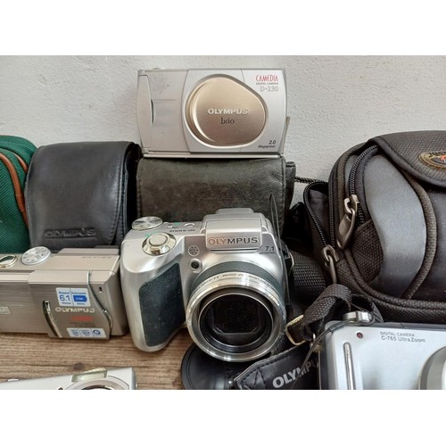 616 - A collection of Olympus digital cameras to include SP-510UZ 7.1mp, FE-190 6mp, Stylus 300, C-60 Zoom... 