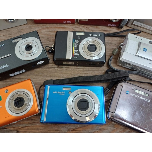 618 - Ten compact digital cameras to include Polaroid i1036 10mp, Praktica Luxmedia 6503 6.1mp, Konica Min... 