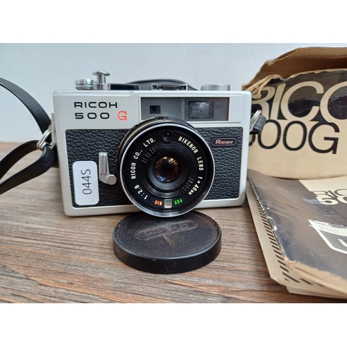 620 - Two items with instruction manuals, one boxed and cased 1970s Ricoh 500G 35mm compact coupled rangef... 