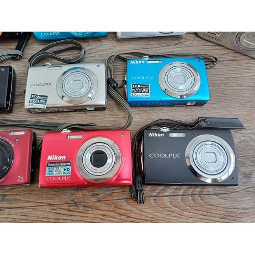 621 - Eleven Nikon Coolpix digital cameras to include S6100 16mp, S6000, two S3000 12mp, S4000 12mp etc.