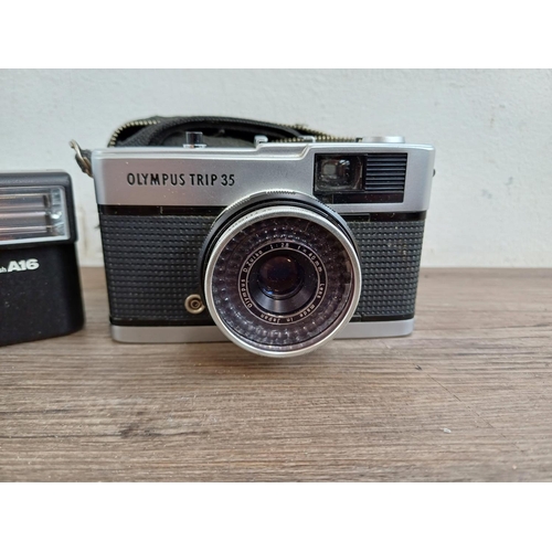 627 - Three Olympus 35mm compact cameras, one 35 RC fixed lens rangefinder, one cased Trip 35 fully-automa... 