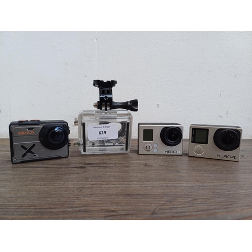 629 - Three action cameras, one waterproof cased GoPro Hero 3 with ABPAK-301 battery BacPac, one GoPro Her... 