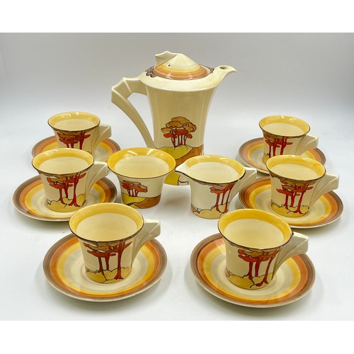 A Clarice Cliff Coral Firs pattern fifteen piece coffee set comprising six cups, six saucers, coffee pot, milk jug and sugar bowl