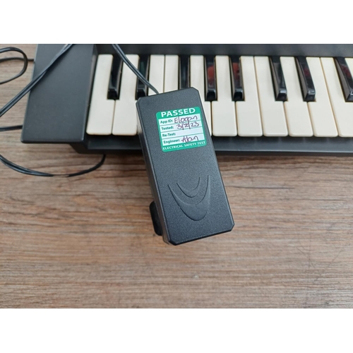 839 - A boxed Yamaha PortaSound PSS-480 Music Station  forty-nine mini-key electronic keyboard with midi i... 