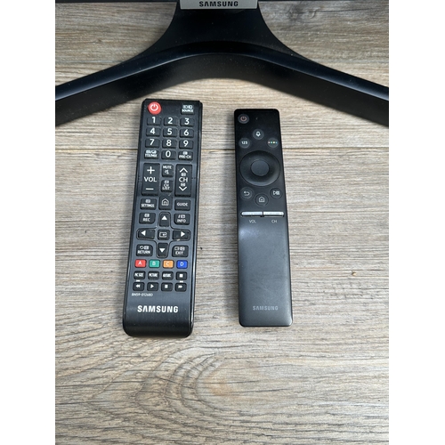 A Samsung UE43NU7400U 4K 43" smart TV with two remote controls