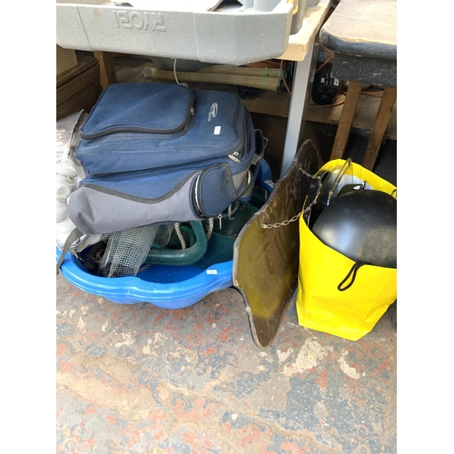 1029 - A large collection of house clearance items to include garden tools, chicken wire, fibrewood underla... 