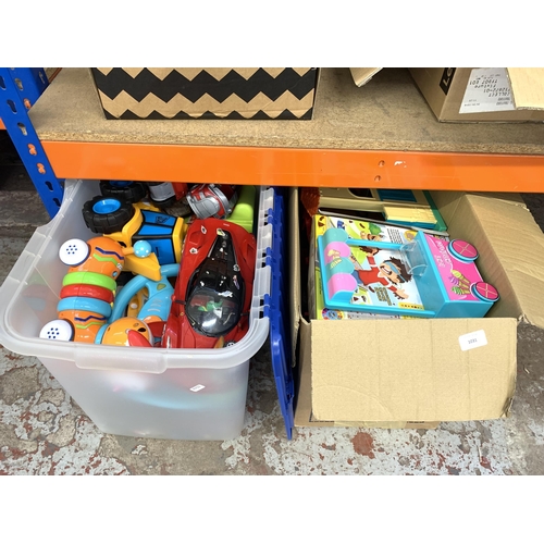 1031 - Two boxes containing toys and games to include Ferrari model vehicle, dolls house, JCB model vehicle... 