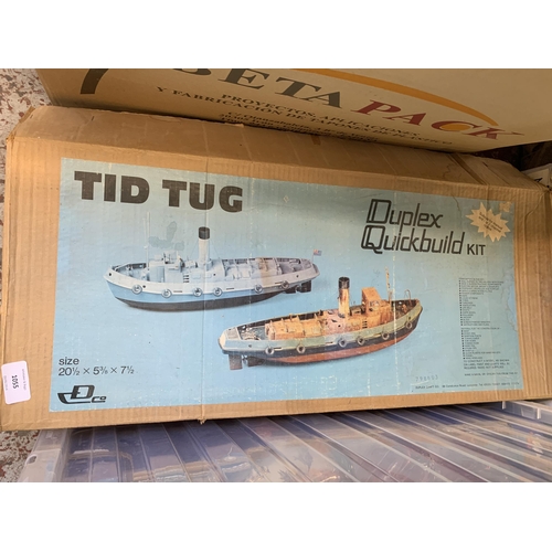 1055 - A boxed Tidtug quick build model boat kit with a large collection of accessories