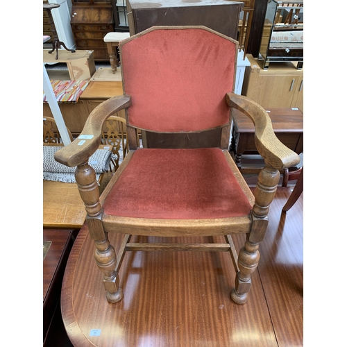 106 - A mid 20th century Harrops Better Furniture oak and fabric upholstered armchair