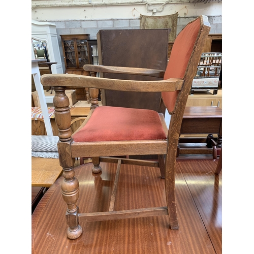 106 - A mid 20th century Harrops Better Furniture oak and fabric upholstered armchair