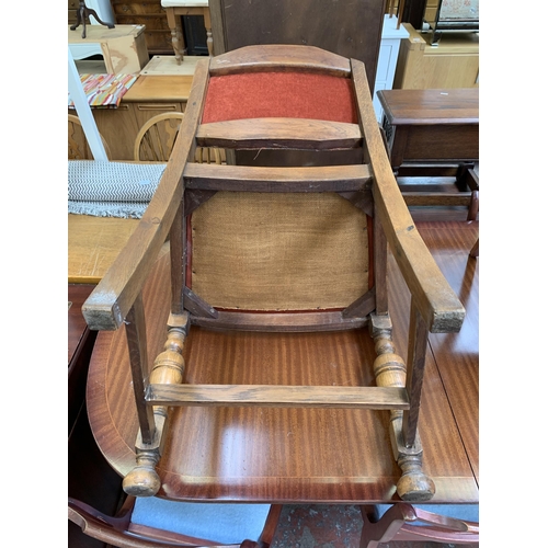 106 - A mid 20th century Harrops Better Furniture oak and fabric upholstered armchair