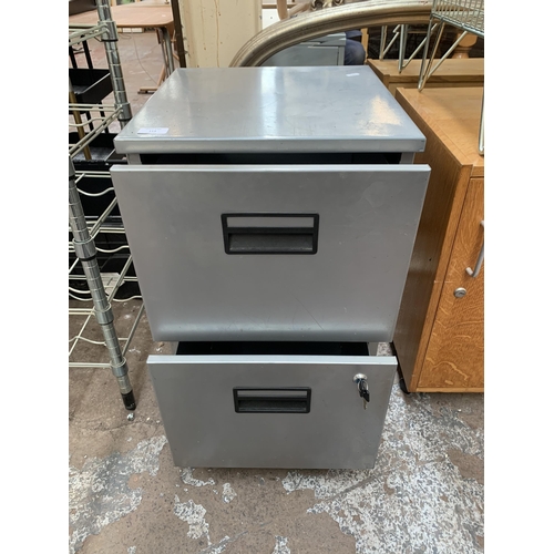 114 - A grey metal two drawer filing cabinet - approx. 69cm high x 40cm wide x 43cm deep