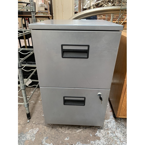 114 - A grey metal two drawer filing cabinet - approx. 69cm high x 40cm wide x 43cm deep