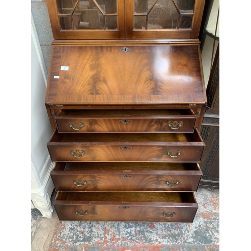 21 - A Georgian style mahogany bureau bookcase - approx. 191cm high x 77cm wide x 46cm deep