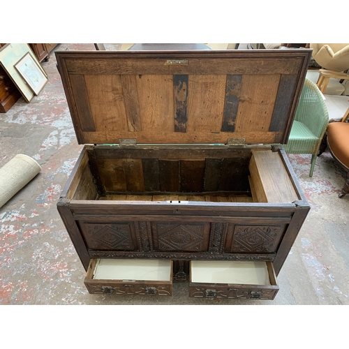 49 - An 18th century carved oak three panel mule chest - approx. 79cm high x 122cm wide x 51cm deep