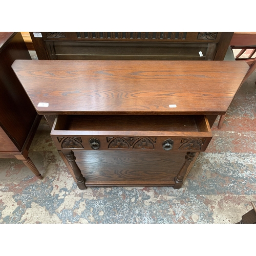 71 - An Old Charm carved oak console table - approx. 77cm high x 107cm wide x 33cm deep