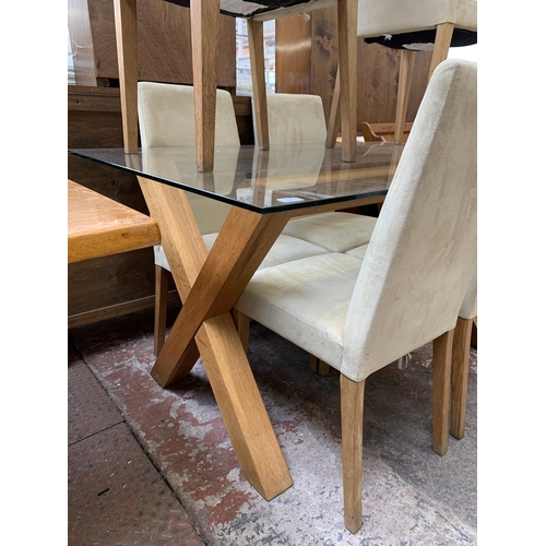 80 - A modern glass top and oak rectangular dining table and six suede chairs - table approx. 76cm high x... 