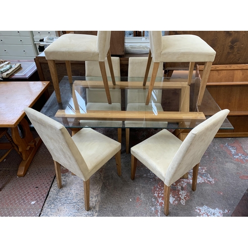 80 - A modern glass top and oak rectangular dining table and six suede chairs - table approx. 76cm high x... 