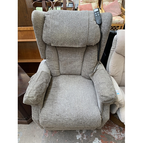 83 - A modern grey fabric upholstered electric rise and recline armchair with power supply and remote